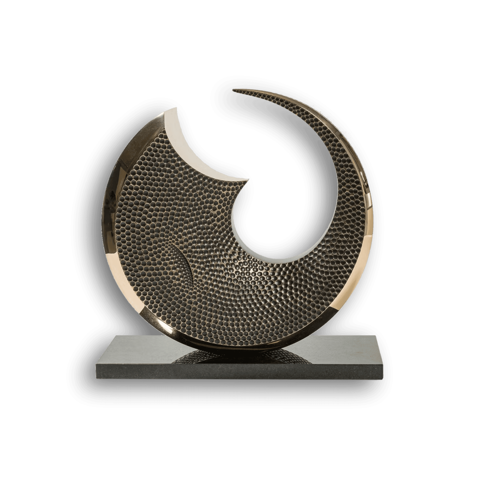 Abstract circular metal sculpture with a textured surface on a rectangular base.